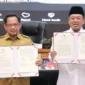 Menteri ATR/BPN Nusron Wahid bersama Mendagri Tito Karnavian menandatangani SEB tentang percepatan verifikasi dan validasi BPHTB (foto: kementerian atr/bpr)